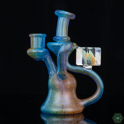 Handcrafted Glass Dab Rig: The Hefe Glass Fumed Recycler is a handcrafted piece, showcasing the artistry and skill of the glassblower.