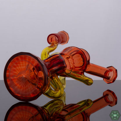 Handcrafted Glass Recycler: This Wolfe Glass recycler is meticulously handcrafted, showcasing the artistry and skill of the glassblower.