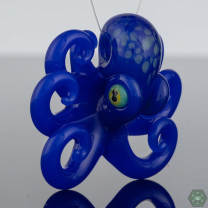 Handcrafted Octopus Pendant: This unique glass pendant by Liz Wright features a whimsical octopus design, handcrafted with high-quality glass and intricate details, making it a perfect piece of art jewelry for ocean lovers and collectors.