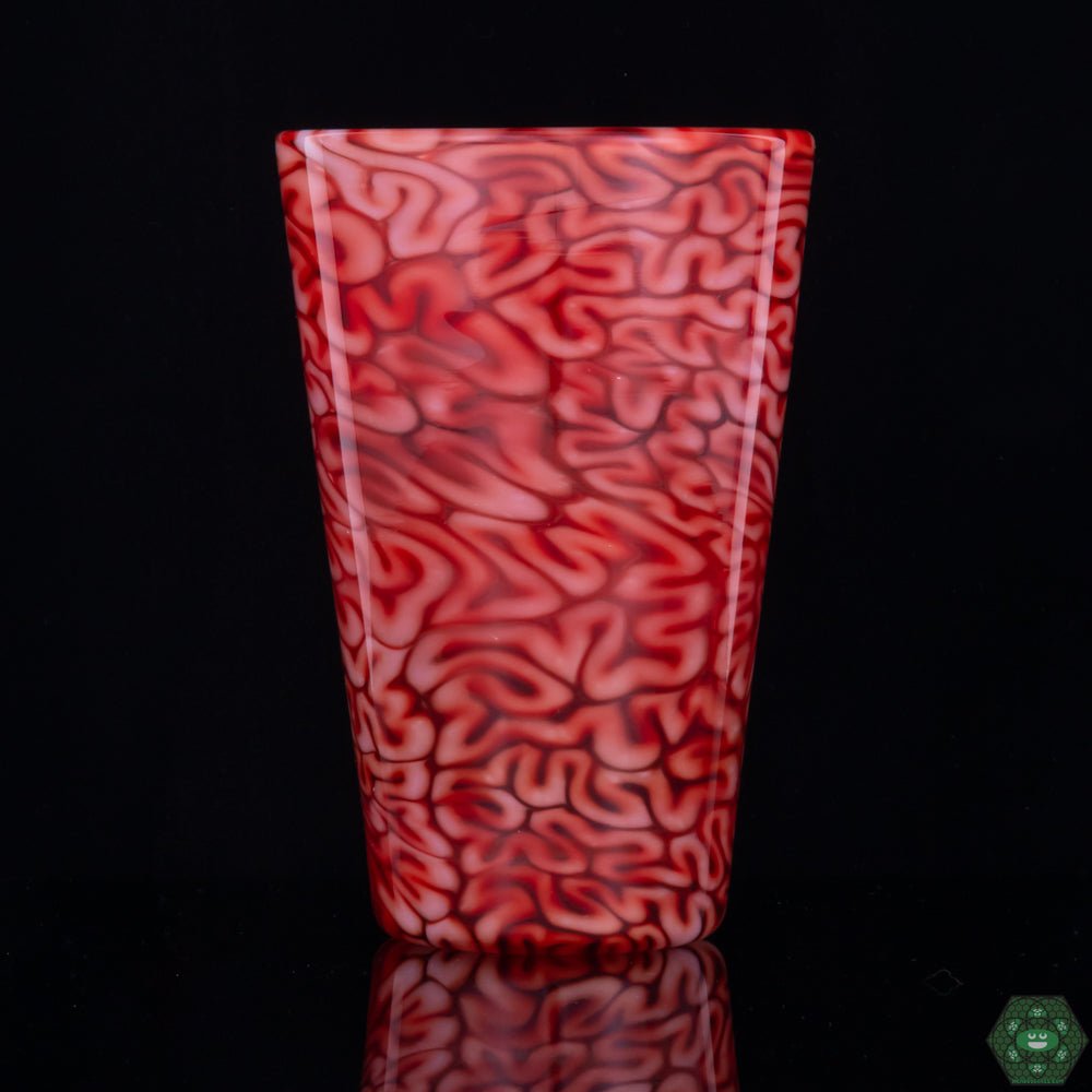 : Handcrafted Red Brain Pint Glass: This unique pint glass from Algae Glass showcases intricate, brain-like patterns in a striking red, highlighting the artistry of handcrafted glasswork.