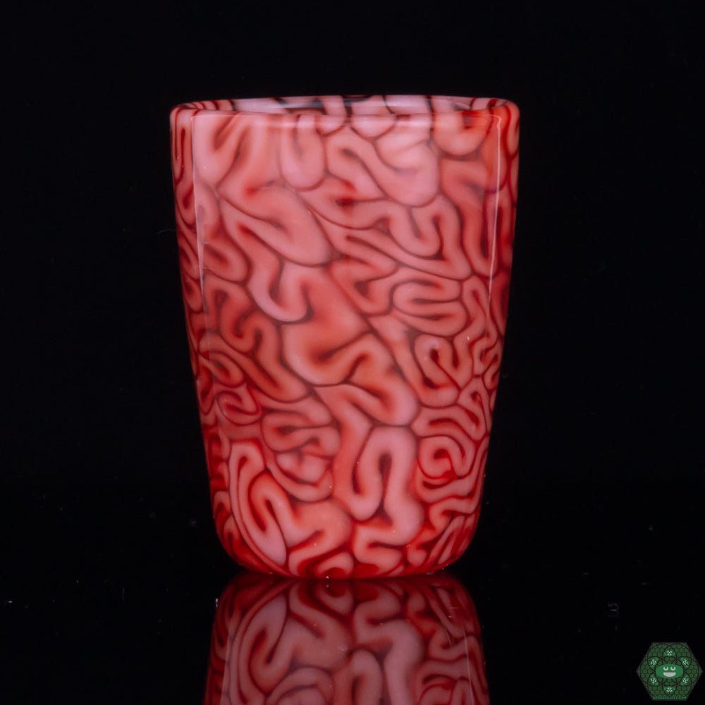 Handcrafted Red Brain Shot Glass: This unique shot glass from Algae Glass features intricate brain-like patterns in a vibrant red, showcasing the artistry of handcrafted glassware.