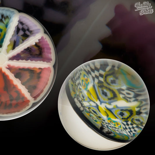 J Fell x Lyons Marble, a unique glass art piece showcasing intricate designs and vibrant colors, perfect for any collection.