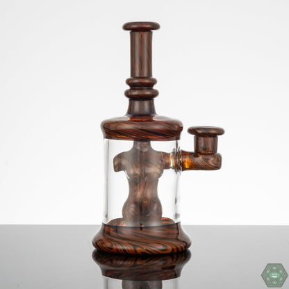  Kaleb Folck BBiB Glass Rig #25, unique heady glass art with UV accents, showcasing masterful glasswork and vibrant UV accents for a dynamic visual appeal, featuring a 10mm female joint and single-hole gil perc, standing at 5 inches tall with a stable 2.5-inch diameter, includes matching bubble cap and artist-styled sticker.