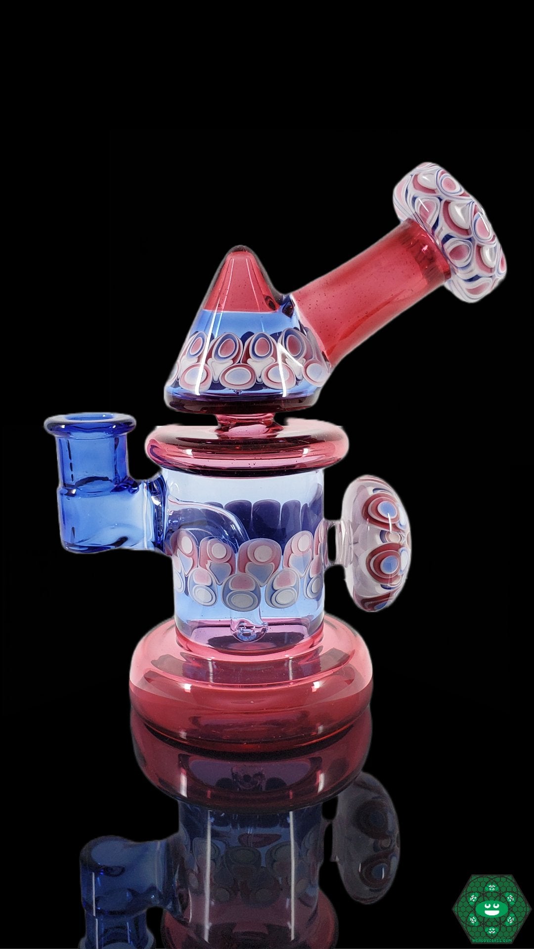 Kickback Jammer Glass Rig: The RL Dots Kickback Jammer is a compact and functional glass dab rig featuring a unique dot stack design and a 14mm joint, perfect for smooth and flavorful hits.