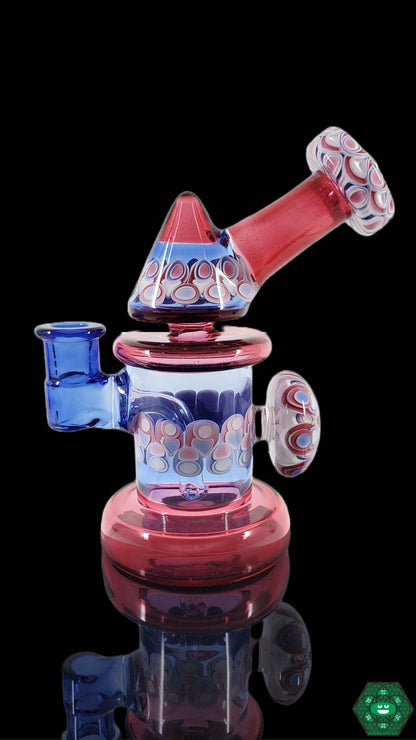 Kickback Jammer Glass Rig: The RL Dots Kickback Jammer is a compact and functional glass dab rig featuring a unique dot stack design and a 14mm joint, perfect for smooth and flavorful hits.