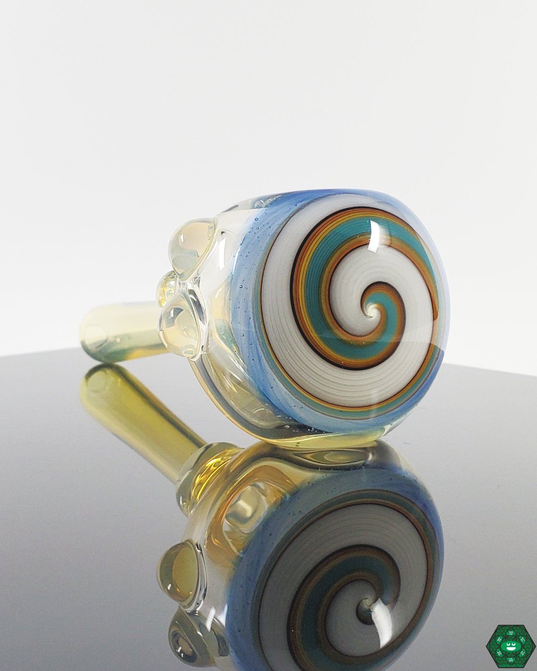  Kyle White Wig Wag Collection, featuring a variety of colorful and intricately patterned glass spoons.