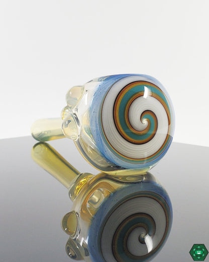  Kyle White Wig Wag Collection, featuring a variety of colorful and intricately patterned glass spoons.