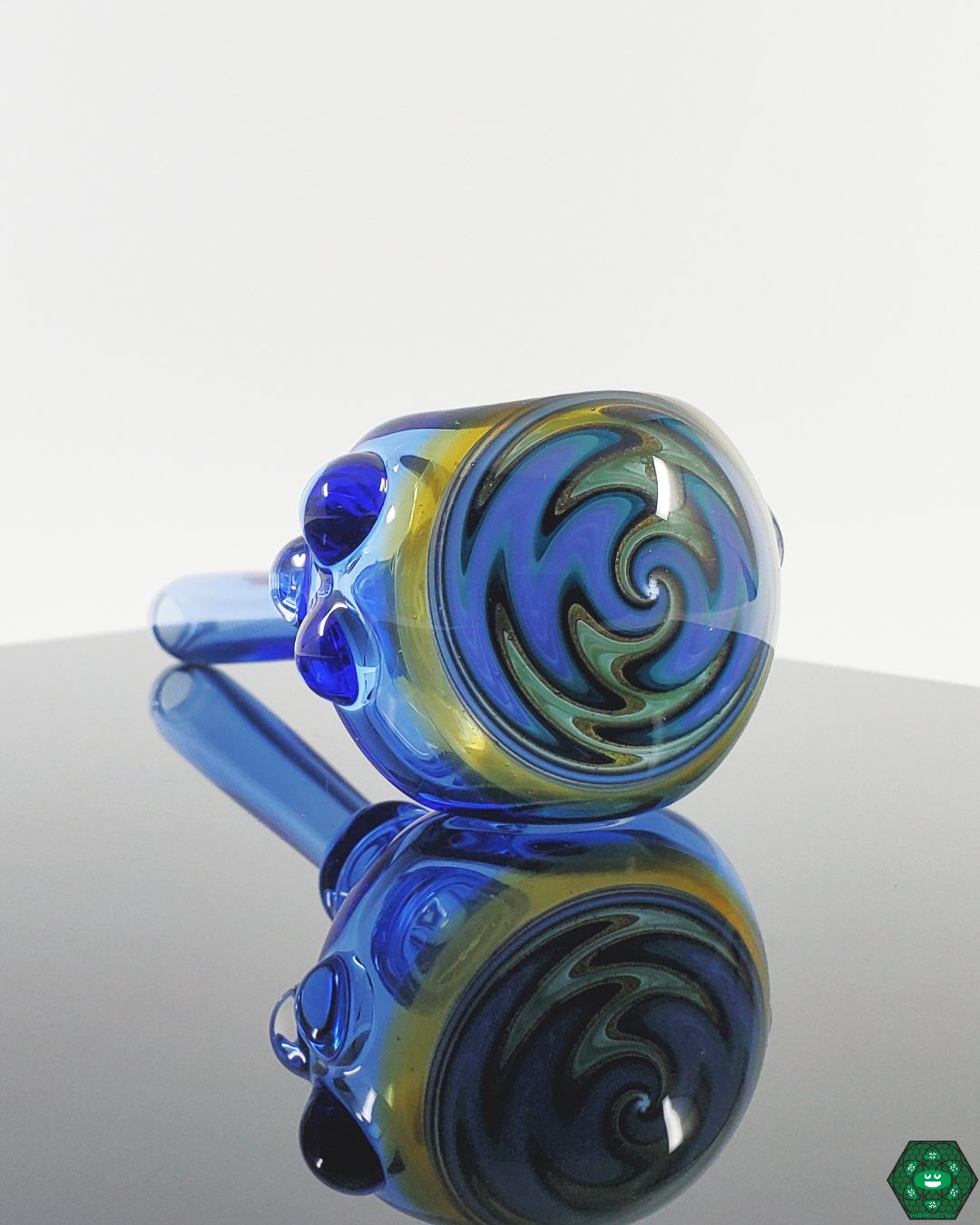 Close-up view of a Kyle White Wig Wag Spoon, highlighting the detail and craftsmanship of the swirling patterns.