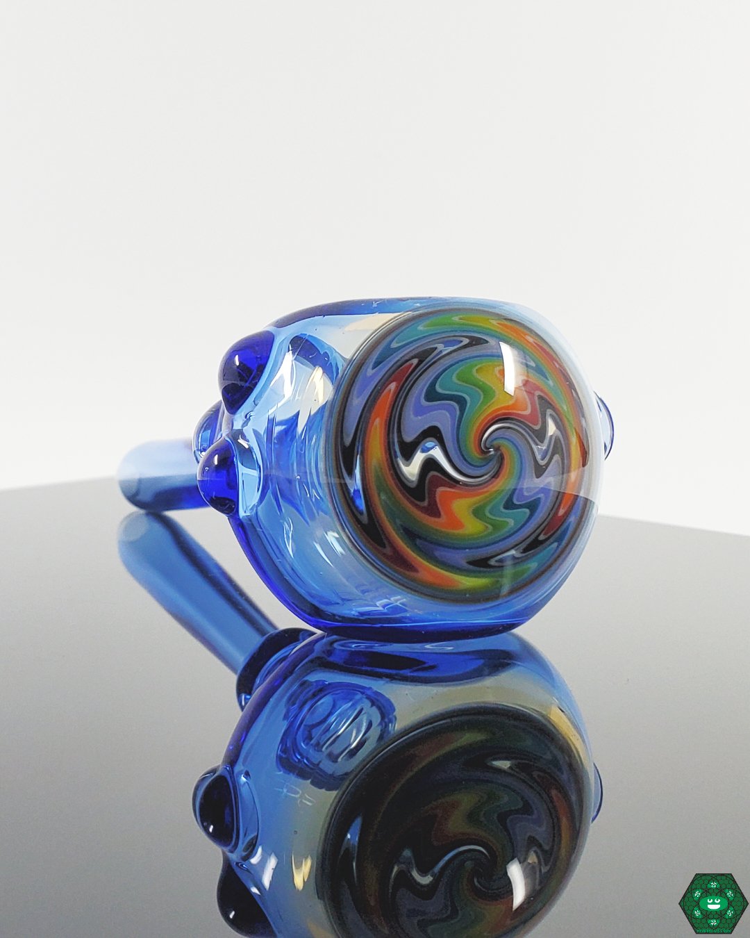 Kyle White Wig Wag Spoon, showcasing vibrant and swirling patterns for a visually captivating smoking experience.


