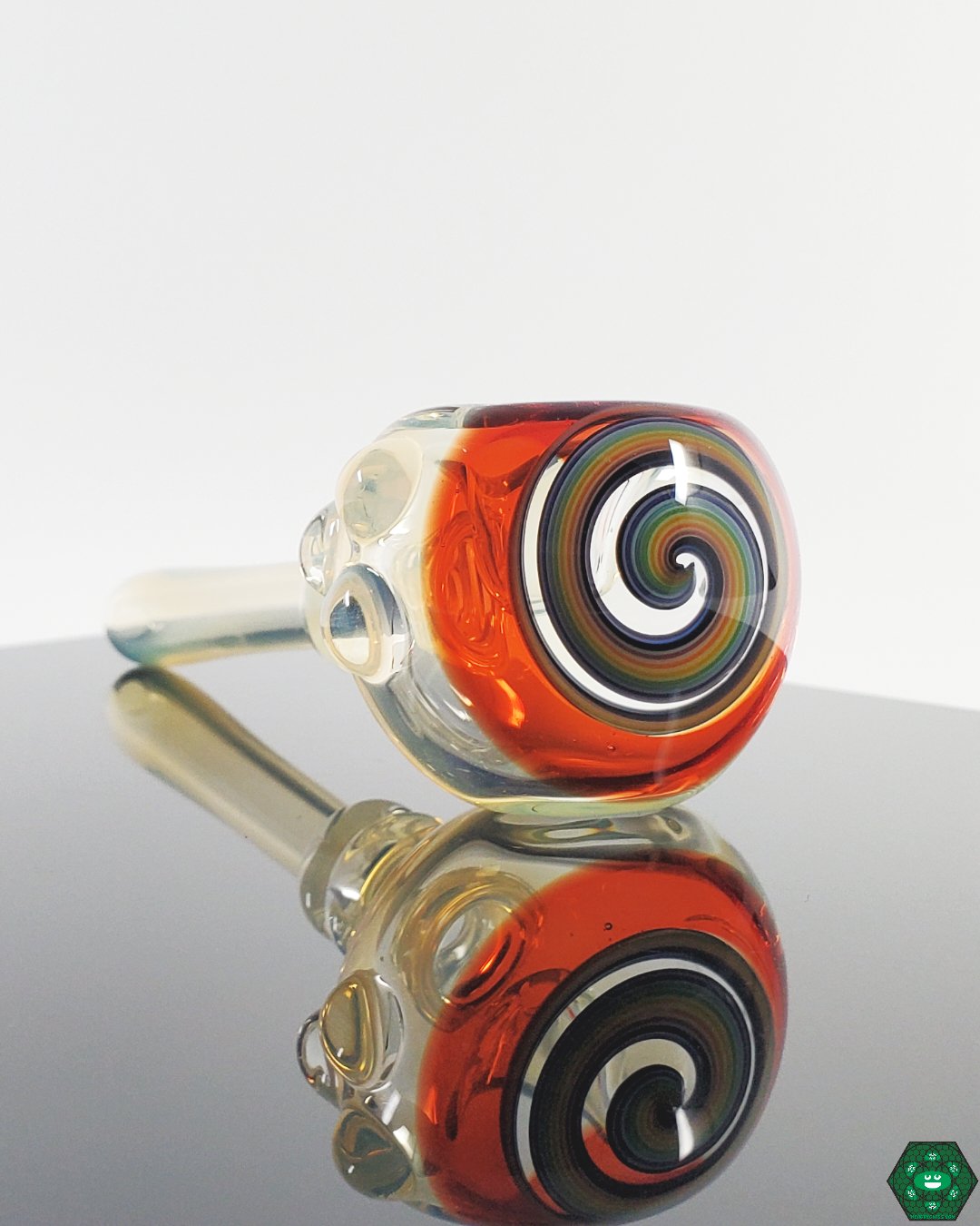Detail of a Kyle White Wig Wag Spoon, showcasing the vibrant colors and intricate swirling patterns.
