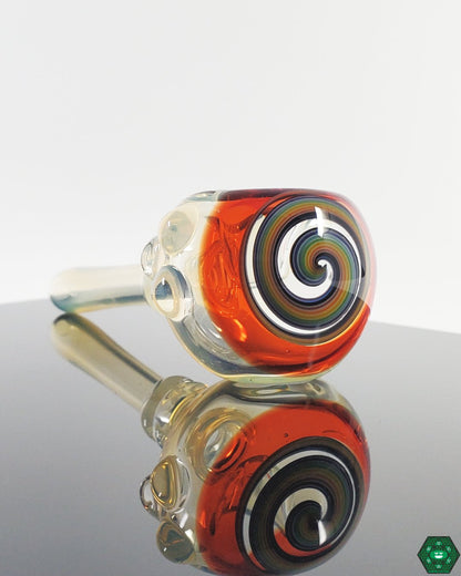 Detail of a Kyle White Wig Wag Spoon, showcasing the vibrant colors and intricate swirling patterns.