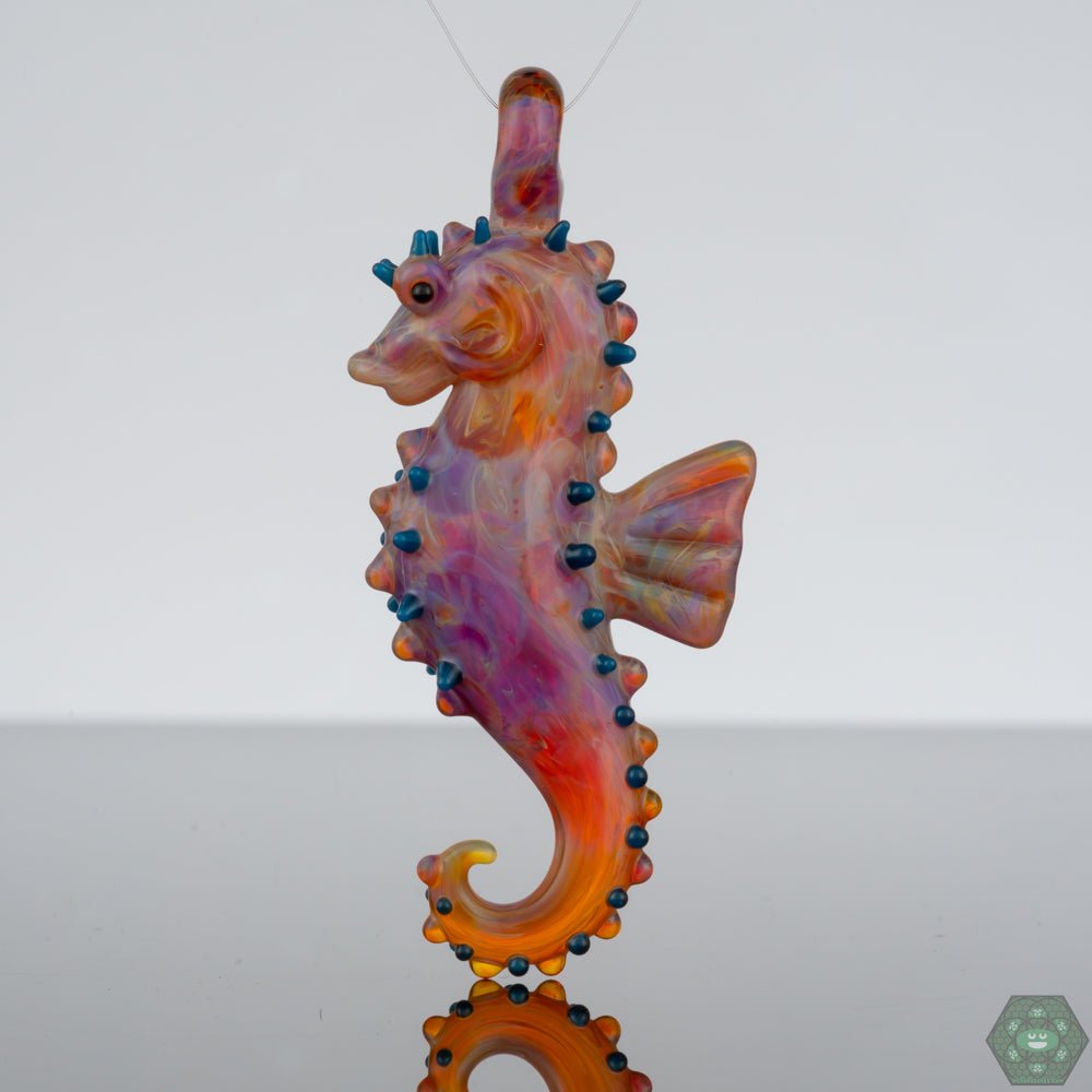 Handcrafted Seahorse Glass Pendant by Liz Wright - Ocean-Inspired Art, an enchanting piece celebrating the wonders of the sea, crafted with precision, featuring a stunning seahorse design capturing the essence of ocean life, with vibrant colors and fine details making it a standout accessory for casual and formal attire, perfect for collectors of unique glass jewelry.