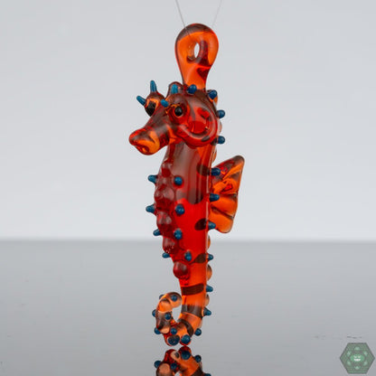 Liz Wright Glass - SElegant Seahorse Glass Pendant #2 by Liz Wright - Unique Art Jewelry, a beautifully handcrafted piece embodying the charm of marine life, featuring a detailed seahorse design highlighted by vibrant colors and artistry, an ideal gift for ocean lovers or a stunning addition to any Elegant Seahorse Glass Pendant #2 by Liz Wright - Unique Art Jewelry, a beautifully handcrafted piece embodycollection, adding a touch of elegance to any jewelry ensemble.eahorse Pendant #2 - @Lizwrightglass - HG
