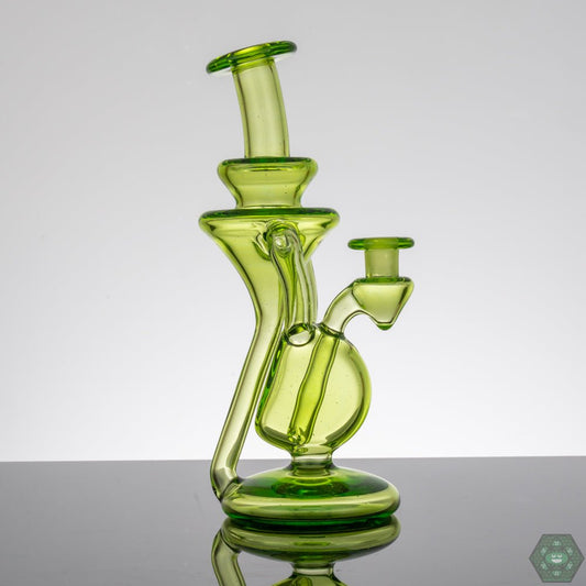  M Henny Absinthe Recycler, a 10mm dual uptake dab rig with a striking green tint, providing exceptional filtration and a smooth, flavorful pull, a top choice for those who value both performance and design.


