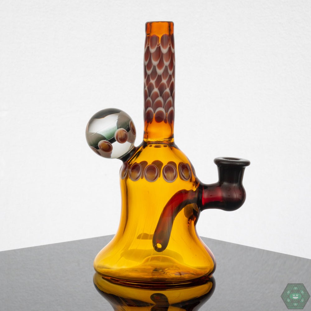 Natrix Glass Mini Tube #12 – Compact 6.5-inch rig with a 3-inch diameter, perfect for collectors with unique Abes Yellow and Red Elvis colors.

