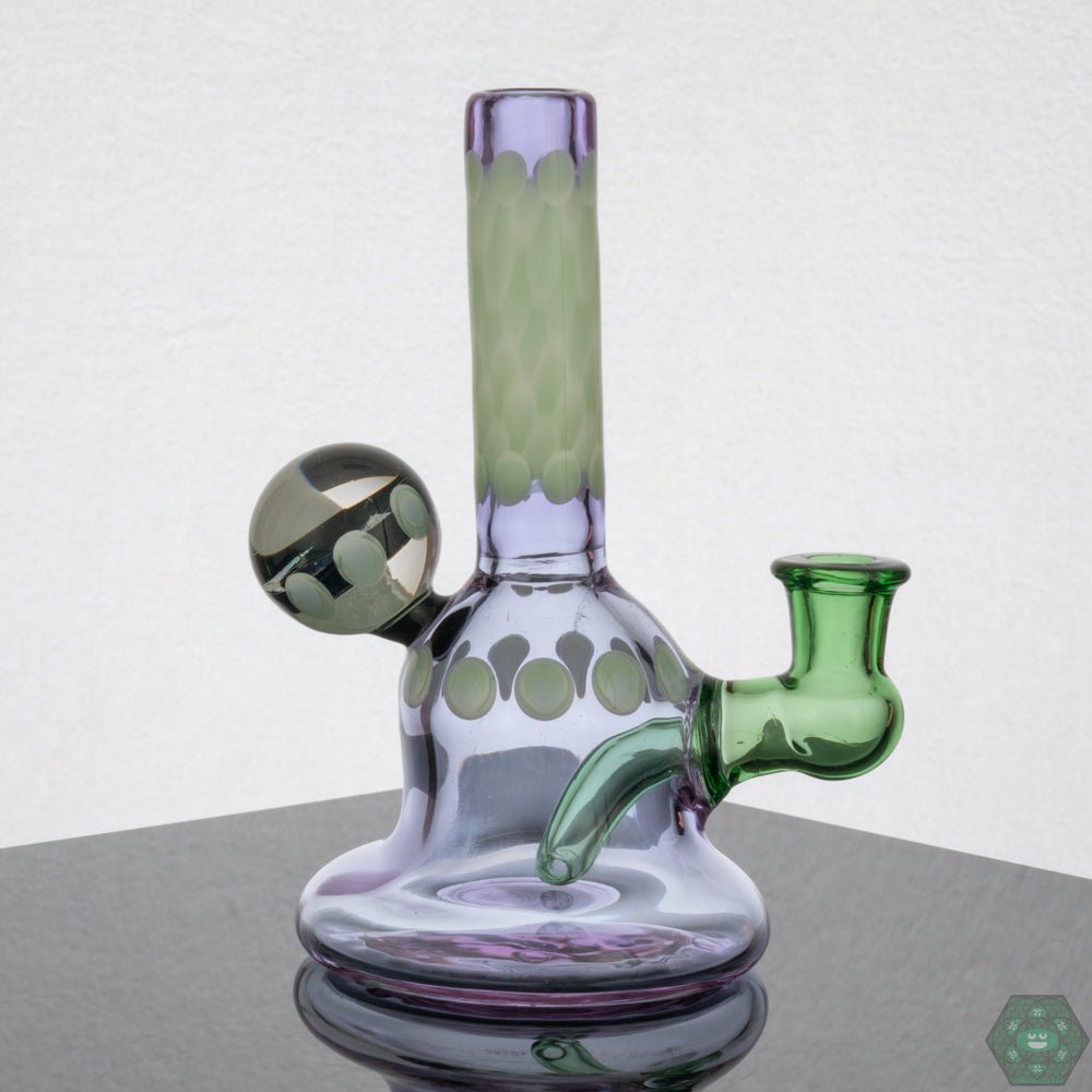 Natrix Glass Mini Tube #9 – Collectible glass rig with dichroic accents and authenticity sticker, ideal for enthusiasts.