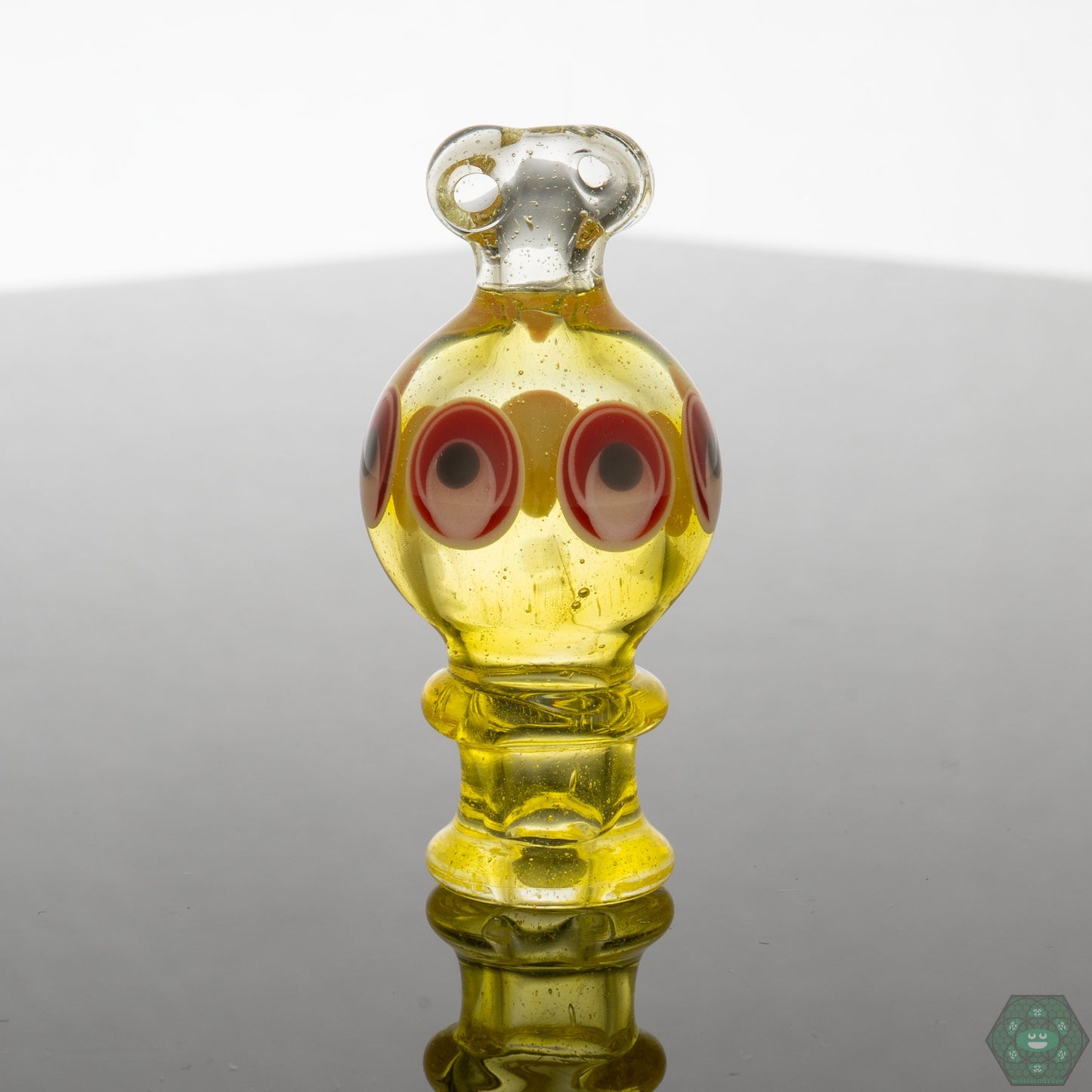 Natrix Glass Spinner Caps, designed for dynamic airflow with a spinner mechanism that ensures even distribution for better vapor, crafted from durable glass for efficient and consistent performance.