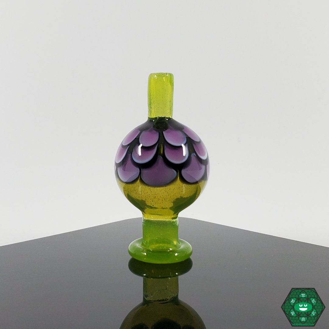 Night WLF Caps, a premium handcrafted glass accessory that adds artistic style to any dabbing setup.