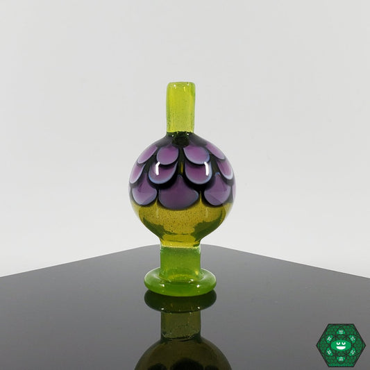Night WLF Caps, a premium handcrafted glass accessory that adds artistic style to any dabbing setup.