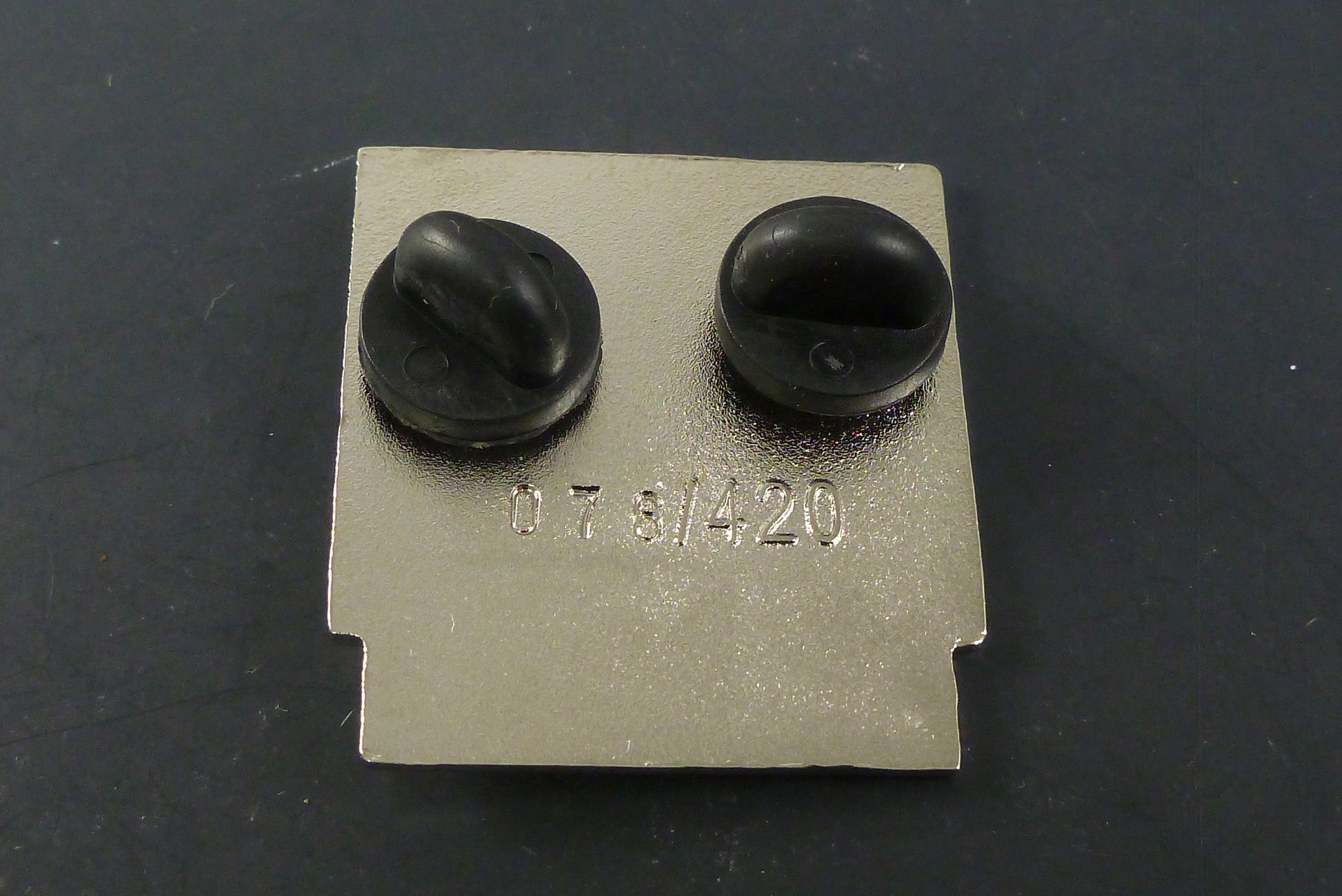 Close-up of the Nintendank Globberman Pin, showcasing its bold design and high-quality enamel finish, ideal for adding a nostalgic touch to any collection.