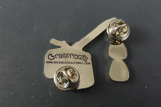  Close-up of the Oil Can Hat Pin, showcasing its unique design and premium enamel finish, ideal for collectors looking for a fun twist in their accessories.