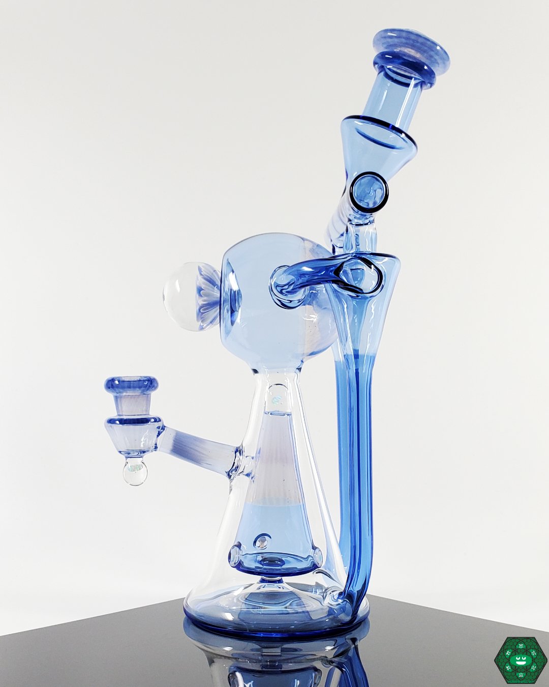 OM Glass Co Double Funnel KR, a dual funnel recycler with a unique flow design, providing smooth pulls and efficient recycling, a standout piece for those who value unique glass engineering.