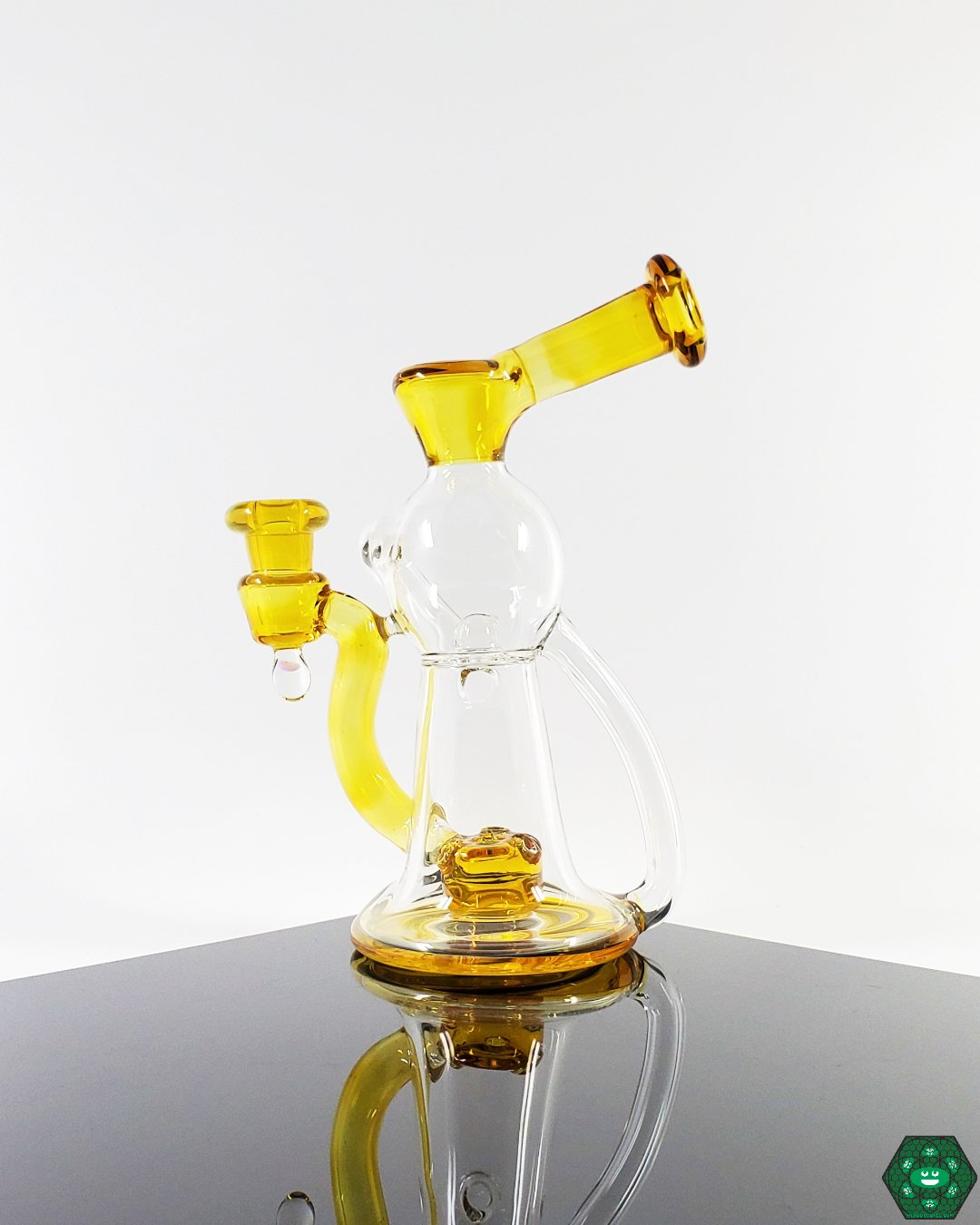OM Glass Co Water Slide, a precision recycler combining unique flow with smooth, enjoyable dabbing, a great choice for enthusiasts who prioritize sleek design and function.