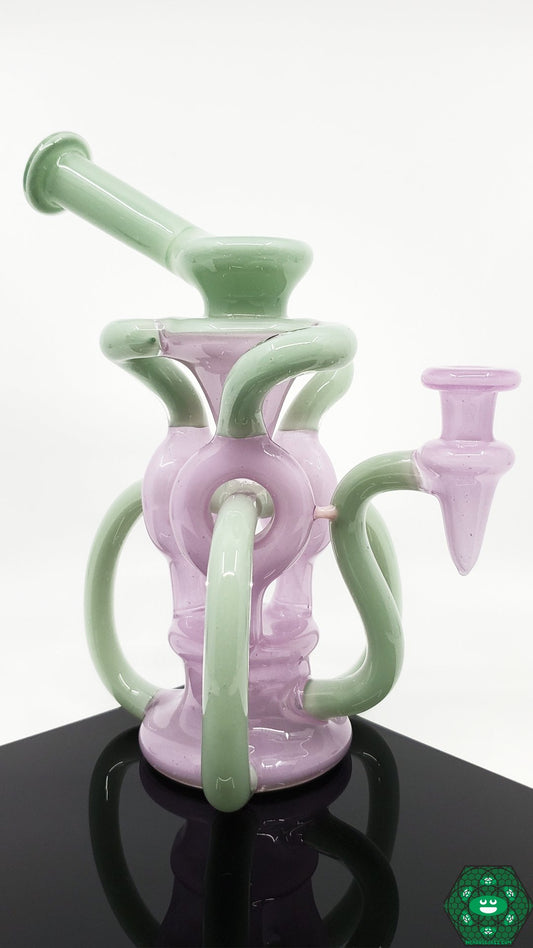 OTW Glass Encased Bubblegum TDTDR Recycler – 8-inch rig with 7-hole perc, triple uptake, and 10mm joint for smooth filtration and vibrant design.