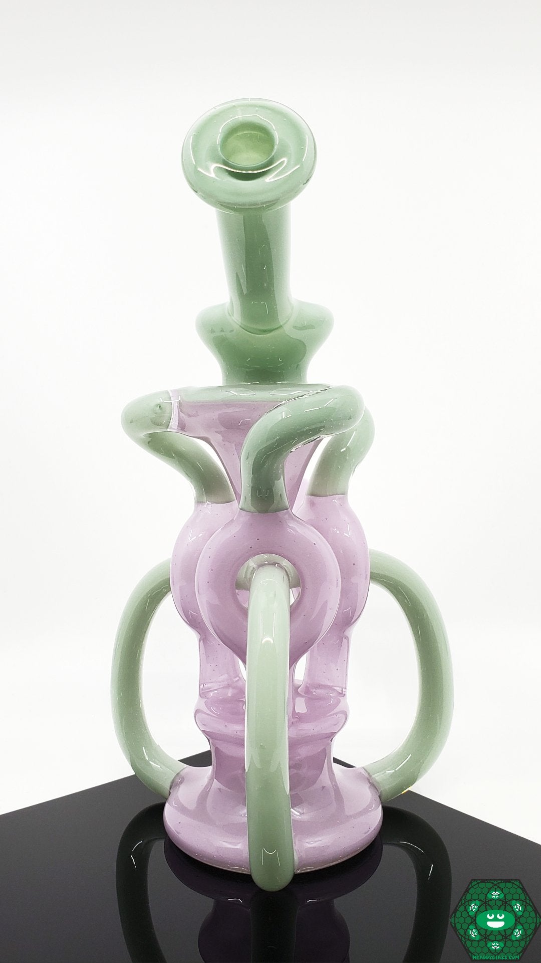 OTW Glass Encased Bubblegum TDTDR Recycler – 8-inch vibrant rig with 7-hole perc and triple uptake for enhanced filtration and smooth hits.