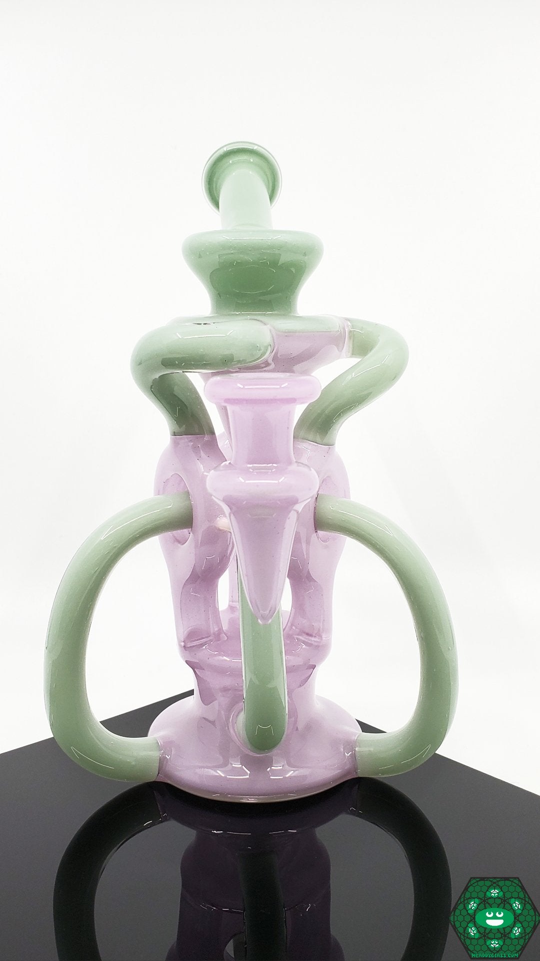 OTW Glass Encased Bubblegum TDTDR Recycler – Vibrant 8-inch recycler with 7-hole perc, triple uptake, and precision filtration for smooth dabbing.