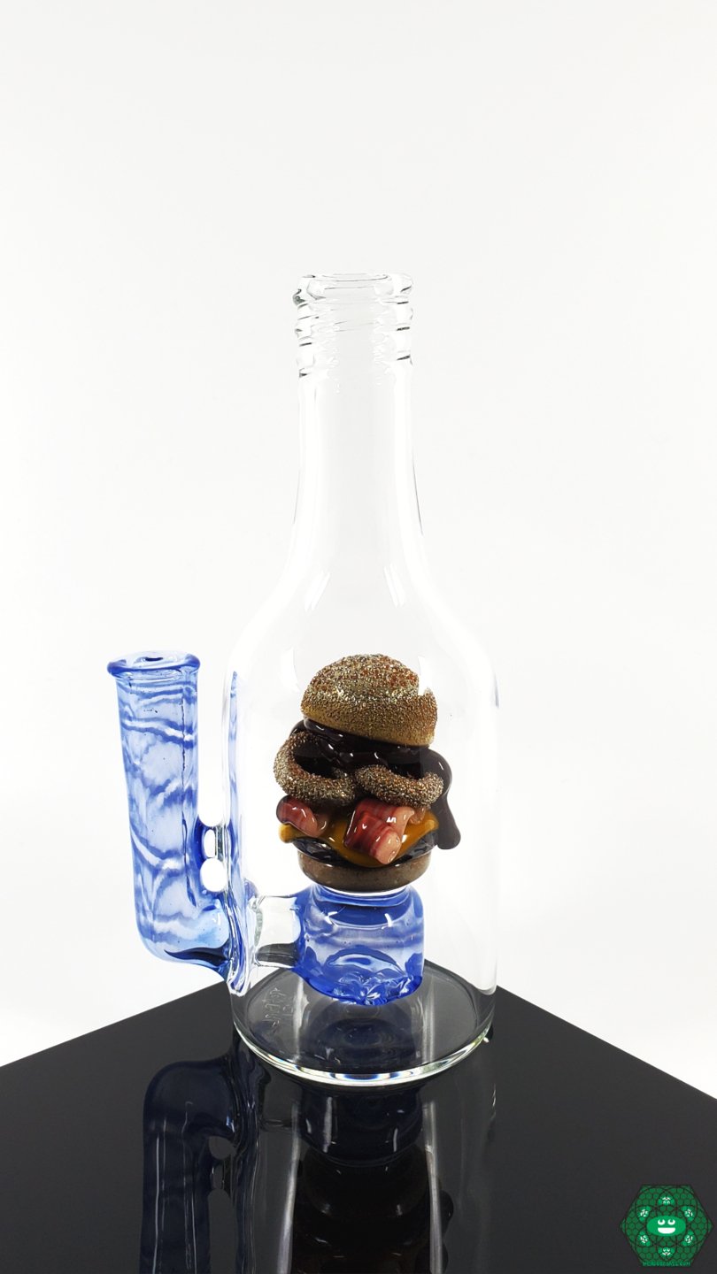 Rosburg Glass 5.75'' Bottle Rig – Blue #2 with 2-hole perc and 10mm joint, designed for smooth pulls and enhanced performance.