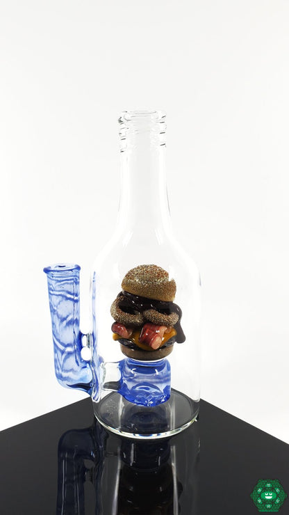 Rosburg Glass 5.75'' Bottle Rig – Blue #2 with 2-hole perc and 10mm joint, designed for smooth pulls and enhanced performance.
