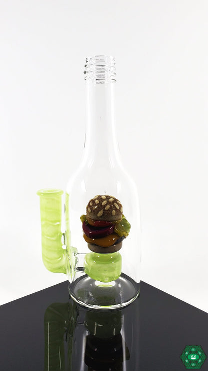 Rosburg Glass Bottle Rig – Slyme Edition with a 10mm joint, combining sleek aesthetics and functionality for a standout dab rig.