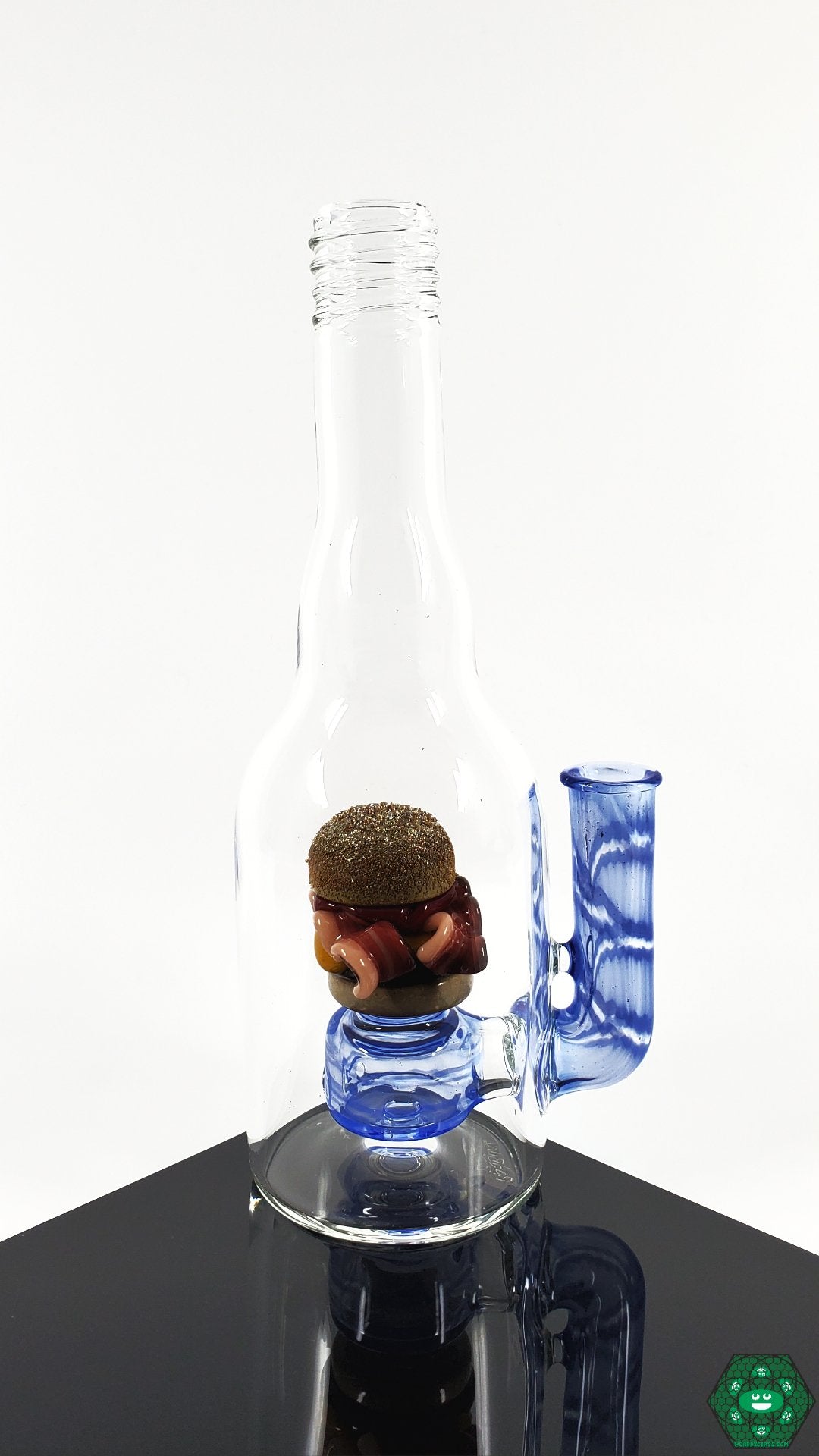 Rosburg Glass Bottle Rig Blue #1 – Collector’s item with 2-hole perc and 10mm joint, complete with a Rosburg Glass sticker and business card.

