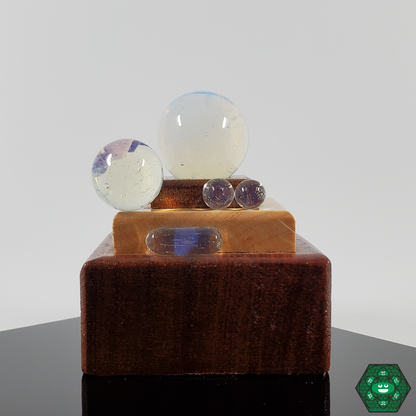 Ruby Pearl Co Slurper Set featuring colorful terp pearls and marbles, crafted for quartz bangers of 20-25MM to enhance heat retention and flavor distribution during dabbing sessions.