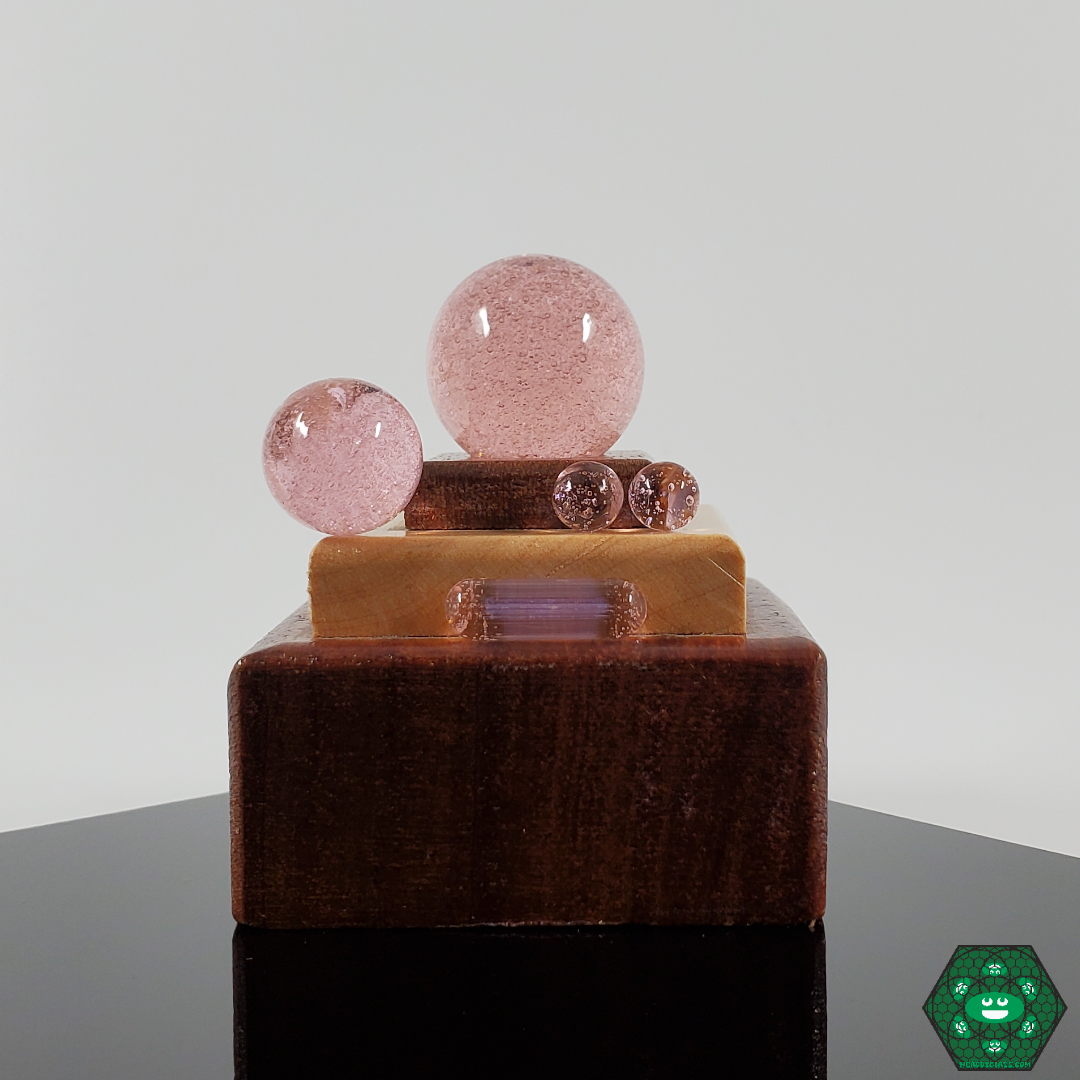 Close-up of Ruby Pearl Co’s colorful marbles, enhancing the visual appeal and performance of your slurper set for a refined dabbing experience.
