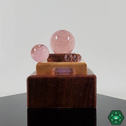 Close-up of Ruby Pearl Co’s colorful marbles, enhancing the visual appeal and performance of your slurper set for a refined dabbing experience.