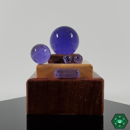  Close-up of Ruby Pearl Co’s terp pearls, showcasing their vibrant colors and design, perfect for evenly distributing flavors during dabbing.