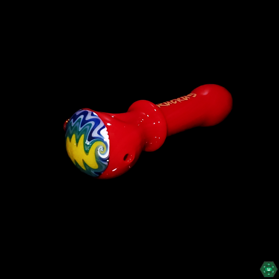 Ruckus Glass Wigwag Spoon featuring intricate swirling patterns, blending visual appeal with functionality for a unique and enjoyable smoking experience.