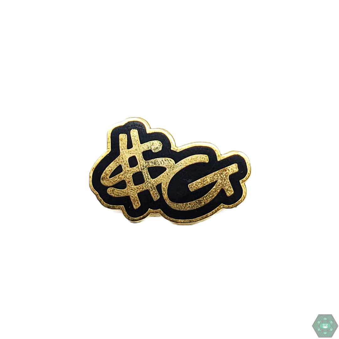 Slum Gold Initials Pin featuring a classic design and durable enamel finish, perfect for showing your love for the brand and adding a stylish piece to your collection.