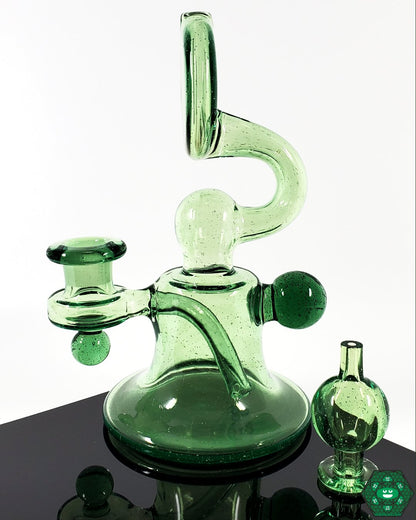 Snafu Glass Voyager Green – Compact 6.25” UV-activated glass rig with matching bubble cap, perfect for smooth, consistent hits.