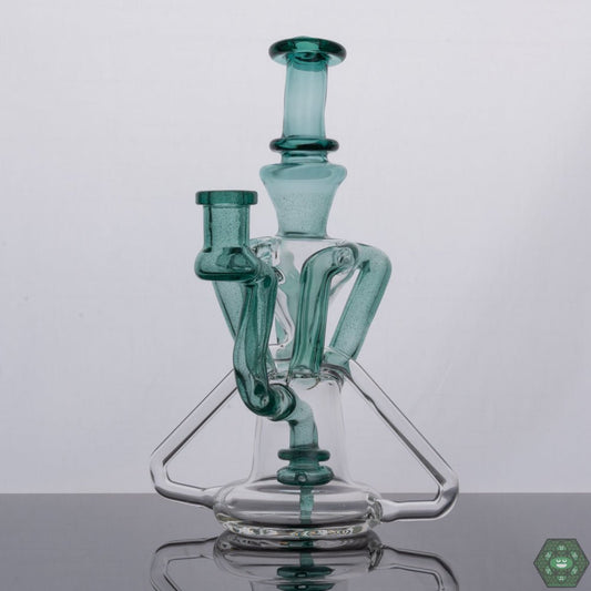 Atlantis Recycler by Spunout Glass, an ocean-inspired recycler rig merging aesthetics with peak functionality, ensuring smooth pulls and optimal filtration for an unmatched experience, featuring aquatic blue tones and an ergonomic design, a must-have for collectors and enthusiasts alike.