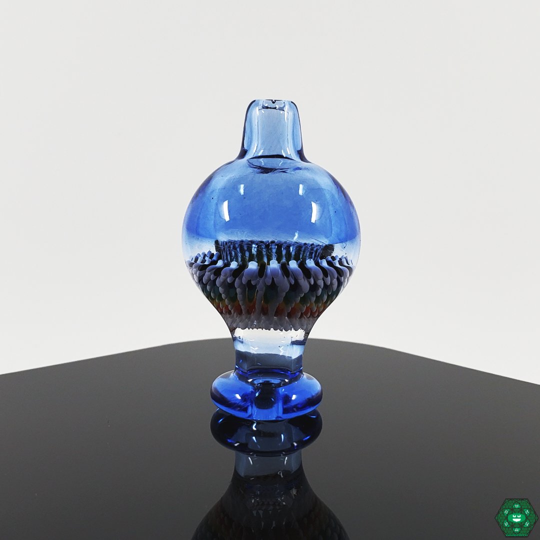 Steve H Bubble Cap, artisan crafted for optimal airflow, handcrafted with a unique design for controlled airflow, made with durable glass to enhance dabbing performance.


