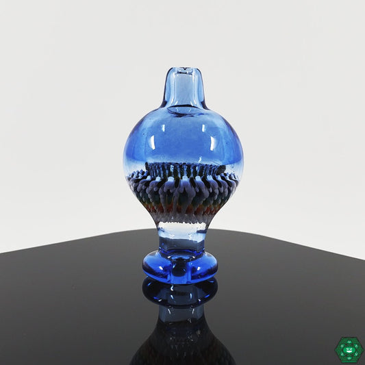 Steve H Bubble Cap, artisan crafted for optimal airflow, handcrafted with a unique design for controlled airflow, made with durable glass to enhance dabbing performance.


