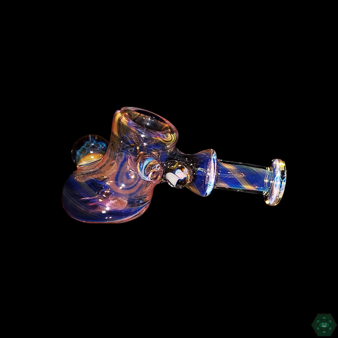 Close-up of the STF Glass Fumed Hammer, showcasing the intricate fumed glass design that evolves in color with use, highlighting its craftsmanship.