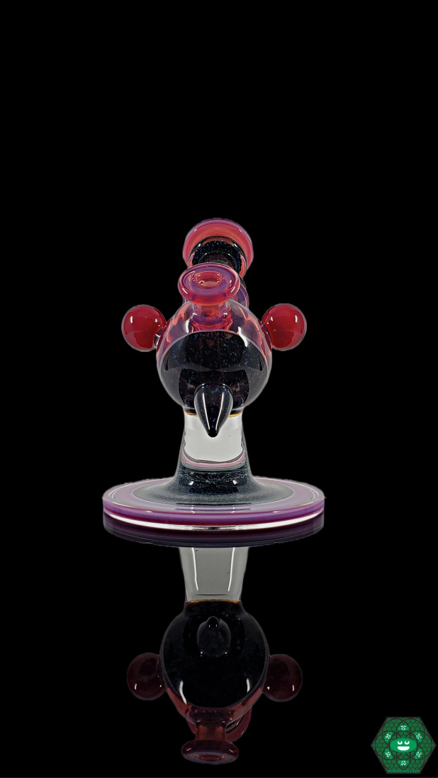 Telemagenta Crushed Opal Heliosphere: The Cajun Glass Telemagenta Heliosphere showcases crushed opal accents and UV-reactive glass in a striking design, perfect for collectors and featuring a versatile 10mm female joint.