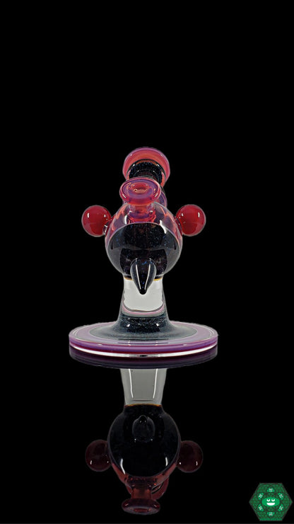 Telemagenta Crushed Opal Heliosphere: The Cajun Glass Telemagenta Heliosphere showcases crushed opal accents and UV-reactive glass in a striking design, perfect for collectors and featuring a versatile 10mm female joint.
