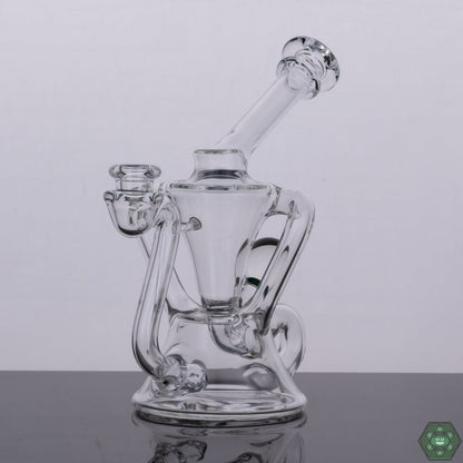  Torch D Boro Clear Mini Klein #1, a compact, handcrafted glass recycler designed for smooth hits, combining functionality and aesthetics with efficient diffusion in a mini size, perfect for collectors seeking high-quality, portable glass with top-notch performance.