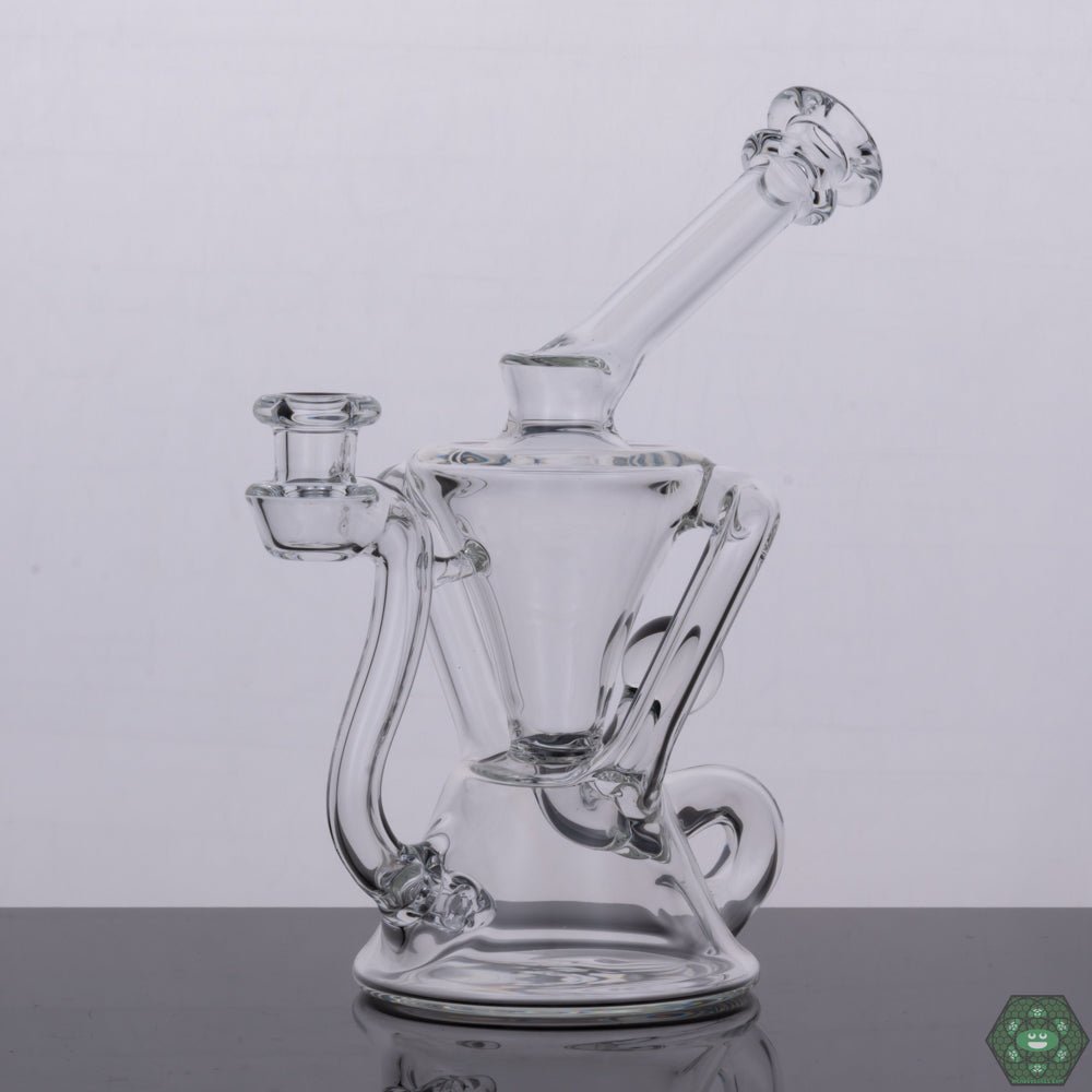 Torch D Boro Clear Mini Klein #4, a handcrafted mini recycler designed for optimal diffusion and smooth sessions, featuring a sleek, clear glass design, perfect for collectors who value both portability and high-quality craftsmanship in their glassware.