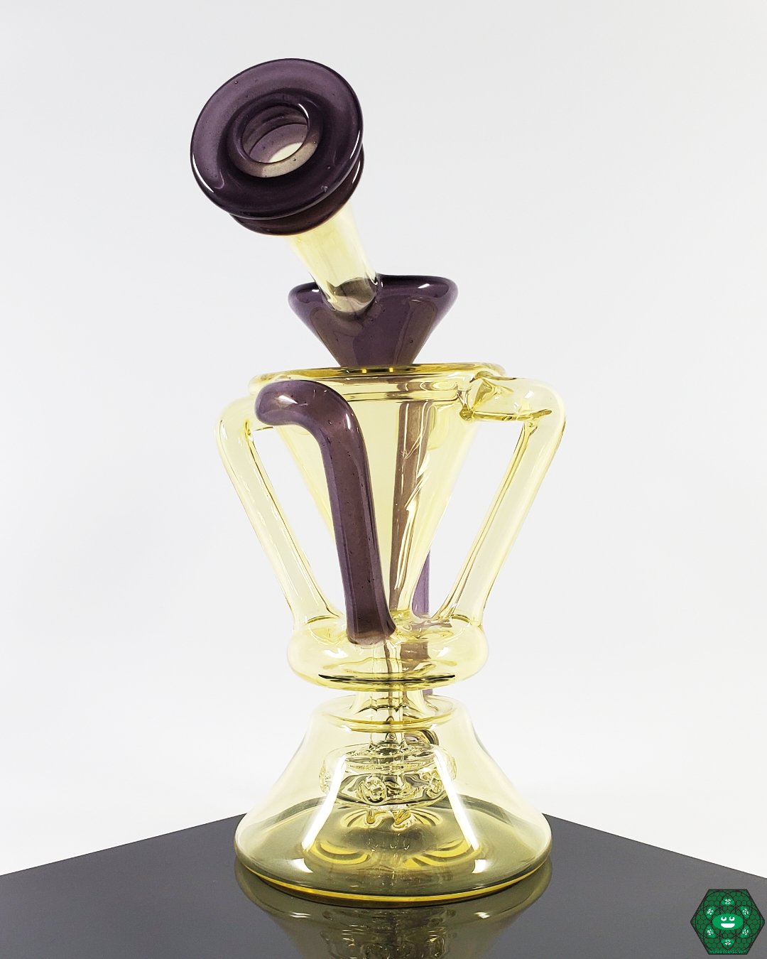 Unique Glass Rig for Concentrates: The McGrew Glass Silver Serum Recycler, showcasing an innovative silver serum feature for enhanced filtration.